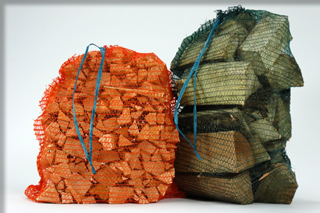 Orange woven Net bags for packing logs and kindling